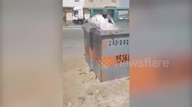 Stranded workers scavenge for food through rubbish bins in Saudi Arabia