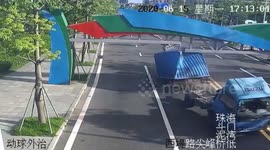 Truck split in two after clipping height restriction barrier in southern China