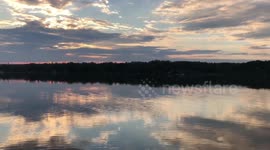 River sunset reflection and catching a fish