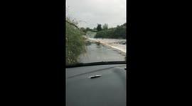 Tense moment car drives through fast-flowing river in northeastern England