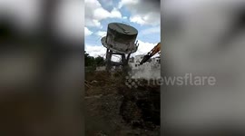 Dramatic moment captures controlled demolition of 40-year-old dilapidated overhead water tank in western India's Gujarat