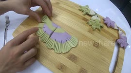 Shaping fish using batter  to make cakes, extremely skillful