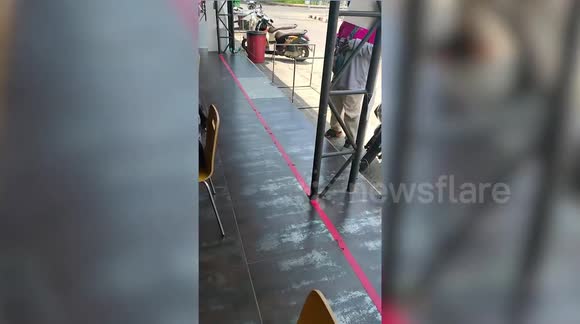 Food delivery rider wears fighter pilot helmet to live-out his ...
