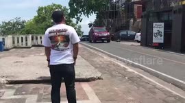 Wild monkey steals tourist's gold chain before it's retrieved from a tree in Thailand