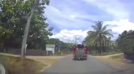 Cargo falls from the back of truck in Thailand