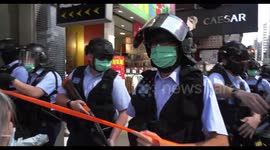 Hong Kong police filmed wrestling elderly pro-democracy protester to ground