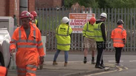 Tall tower demolished using explosives