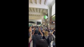 Exiting La Defense hands in the air