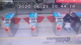 Chinese girl knocked over by ticket machine gates at train station