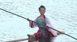 Chinese woman shows off impressive dancing movements on singular bamboo raft