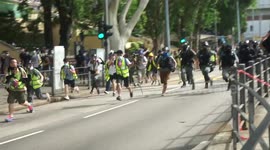 Protesters seen running to evade arrest in wake of new Hong Kong security law