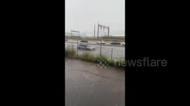 Mini Cooper gets stuck during flash flood in New Jersey