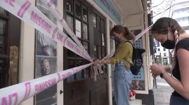 Protesters wrap London theatre in pink tape to protest possible closures