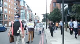 Protesters March Through London chanting 