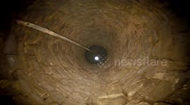 Descending 40ft into a dry stone lined water well