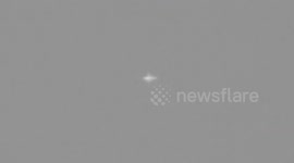 Flashing UFO type object seen close to aircraft filmed with a full spectrum camera conversion