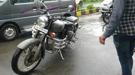 Hidden snake spotted moving beneath bike seat before retreating to woods in western India