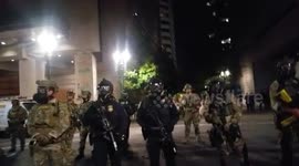 Police officers conceal name tag, badge number at Portland protest