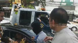 a citizen rages with transportation officials when his vehicle gets towed