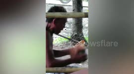 Filipino man removes coconut husks with his teeth