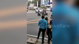 Chinese woman 'spits at police and attacks cyclist after jaywalking' in the Philippines