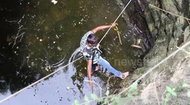 Rescuer pulls out two rat snakes from 60-feet deep well in India