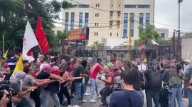 Protesters attempt to pull down first ring of barbed wire outside US Embassy in Beirut