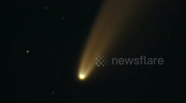 Comet Neowise moving against background stars