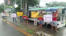 Struggling bus drivers beg in the street for food in the Philippines