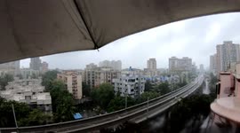 Umbrella flying in the air due to stormy weather in Mumbai, Maharashtra