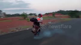 Scooter fanatics ride one-wheel vespa in Indonesia