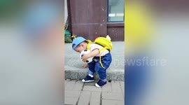 Chinese toddler is so adorably careful climbing down one step