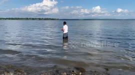 Canadian dad catches sunfish with huge lamprey on it