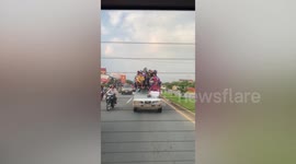 Car travels with whole family or 18 people crammed onto the roof