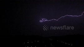 Elongated fork lightning captured above the skies of Lisbon