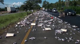 Truck spills hundreds of cans of beer onto road in southern Thailand