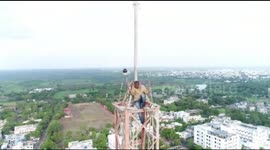 Man climbs 300-foot-tall mobile tower in India to get his estranged wife back