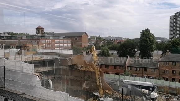 Watch a long-reach excavator make light work of London car park