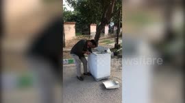 Man rescues monitor lizard after it was found in washing machine in northern India