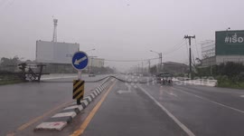 Family escape alive after electricity wires blow onto car during storm