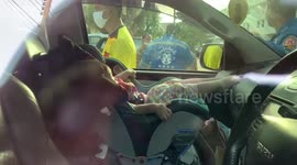 Firemen rescue two girls accidentally locked inside car with engine running