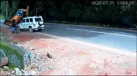 Man saved by SUV as earthmover about to hit him