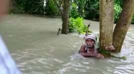Officials rescue elderly man stranded in shoulder-high floodwater amid deluges in northern India