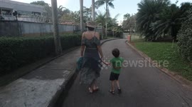 My Wife walking with our son.