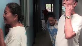 Python tries to bite snake wrangler after being caught in family's roof