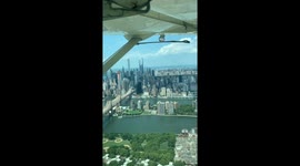 Look at New York's skyline from a different perspective as this seaplane lands in the East River