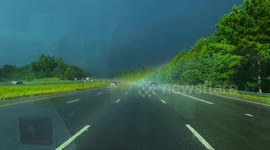 US woman drives through end of a rainbow in magical footage