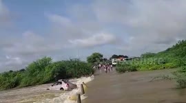 Passengers make miraculous escape after their car is swept away by flash floods in southern India