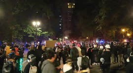 Protesters seen running as police threaten to fire tear gas in Portland