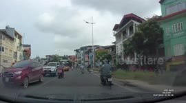 Overtaking Motorcycle Rider Hit By Car